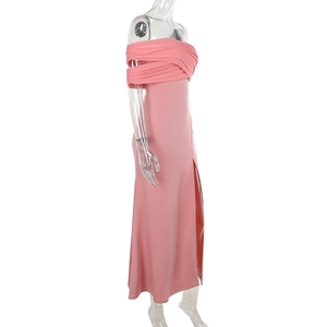 Detailed side view of pink off-shoulder dress with layered pleats and a high slit detail