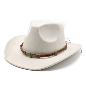 Detail of western cowboy hat with brown braided leather band and skull metal buckle