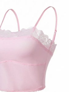 Detail of pink lace trim and adjustable straps on a seamless wireless comfort bra