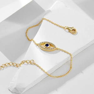 Elegant gold S925 silver evil eye bracelet with blue stone and white zircon details