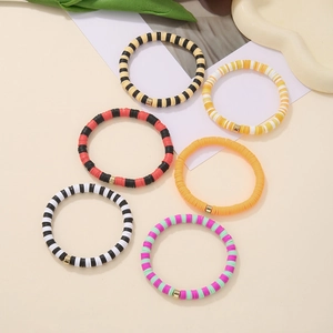 Detail of 6-piece bohemian beaded bracelet set with colorful polymer clay heishi discs