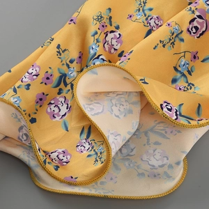Macro detail of high-quality floral chiffon fabric with fine rolled hem stitching work