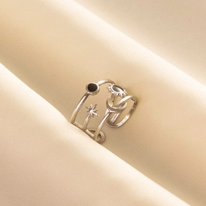 Star and moon themed adjustable open ring with black enamel details in silver finish