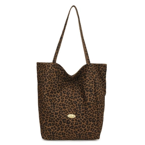 Detail shot of leopard print tote bag featuring fabric texture and handmade logo plate