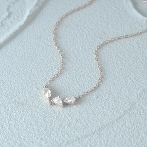 Close-up of 925 sterling silver necklace featuring three pear-cut zircon cluster pendant