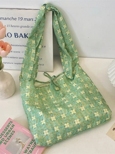 Floral print green cotton tote bag with knot shoulder straps and ribbon closure