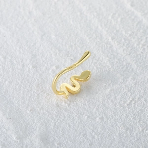 Macro shot of S925 sterling silver golden snake nose cuff with hallmark detail