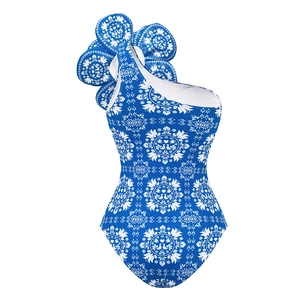 One-shoulder royal blue swimsuit with white ethnic print and 3D floral decoration