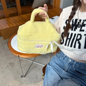 Portable soft yellow plush cosmetic bag with handle for travel skin care storage