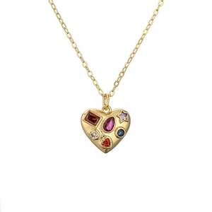 Gold necklace with heart pendant featuring colorful gemstones and star charms
