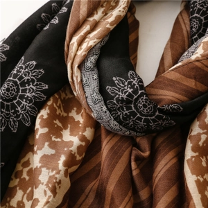 Detail view of floral and leopard print scarf with soft cotton-linen texture
