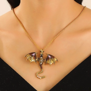 Detail of a gold dragon necklace with purple crystals on a model for jewelry styling