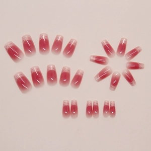 Detail of 24pcs pink ombre press-on nails with fine glitter and lace coffin design