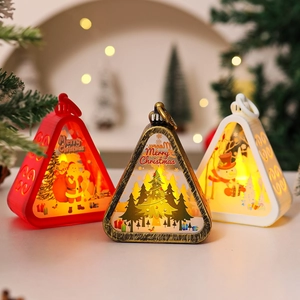 Close-up of LED Christmas lanterns in three colors with festive Santa and snowman motifs