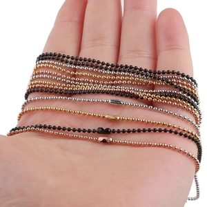 Hand holding 1.5mm stainless steel ball chains in black, gold, silver, and rose gold