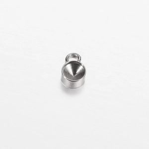 Close-up of polished stainless steel round pendant base for DIY jewelry making