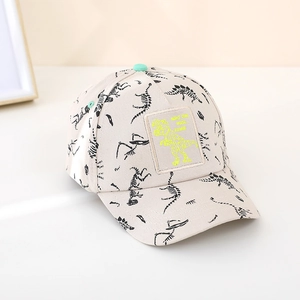 Detail showing high-quality dinosaur skeleton print and decorative patch on the cap