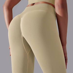 Detail of khaki ribbed seamless leggings showing high waist and scrunch butt design