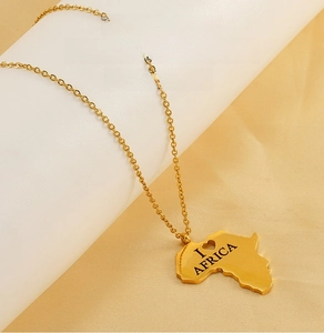 Detailed close-up of gold-plated Africa map pendant necklace with I Heart Africa engraving