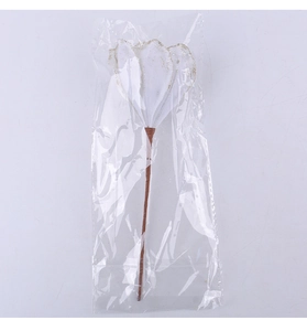 Detailed view of artificial Christmas flower decoration in white petals with gold edges