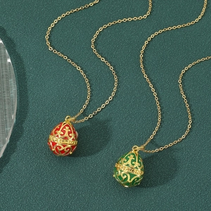 Elegant gold egg necklaces with red and green enamel in a royal Russian vintage style