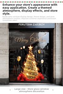 Detail of golden Christmas tree and balloon window decals for festive store displays