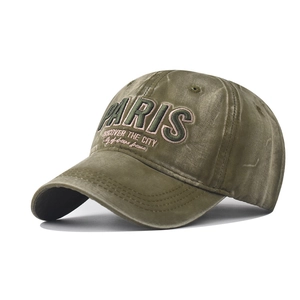 Close-up of olive green velvet baseball cap with vintage PARIS 3D embroidery detail