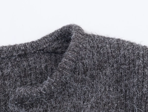 Close-up of charcoal gray knit fabric texture and premium collar stitching detail