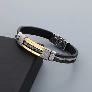 Detail of men's silicone bracelet with stainless steel Greek pattern and metal mesh