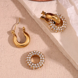 Detail of 18K gold-plated stainless steel donut earrings with micro-set rhinestones