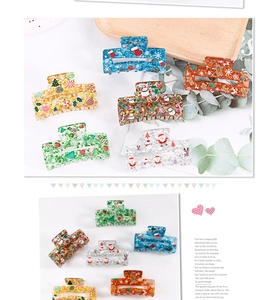 Detail of Christmas-themed hair claw clips with star sequins and festive holiday patterns