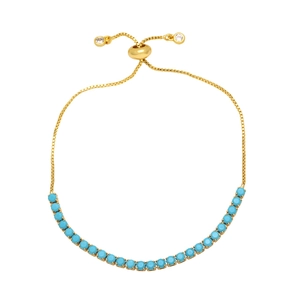 Detailed close-up of adjustable gold bracelet with turquoise stones and drawstring closure