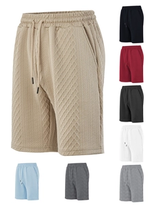 Detail view of waffle texture fabric and drawstring on men's retro casual shorts