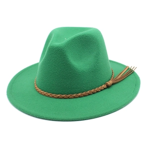 Close-up of green wool fedora hat with brown braided leather band and tassel detail