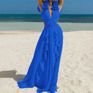 Deep V-neck cutout blue beach dress featuring a decorative ring and ruffled skirt details