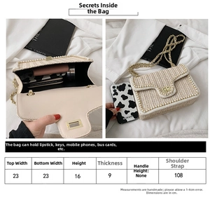 Size guide for straw crossbody bag with dimensions 23x16x9cm and pearl chain details