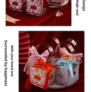 Detail of floral gift boxes with colored ribbons and For You handle on red velvet
