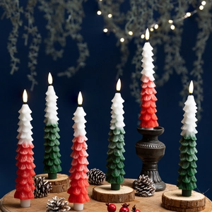 Christmas tree LED candles with red and green gradients on wooden bases in a festive scene