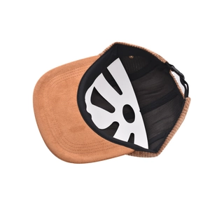 Detail of brown corduroy baseball cap showing internal lining and adjustable back buckle