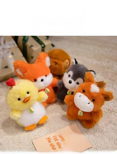 Close-up of small plush animal keychains including chick, fox and bear on a soft rug