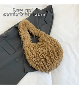 Macro detail of the soft camel faux fur texture on this stylish plush shoulder bag