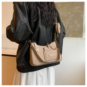 Detail of khaki leather shoulder bag with detachable coin purse and wide logo strap