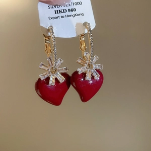 Close-up of S925 silver gold-plated red heart earrings with zircon snowflakes