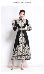 Detail of vintage paisley print dress with long sleeves and button-up front design