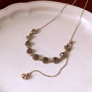 Exquisite rose gold adjustable necklace featuring a row of sparkling grey rhinestones