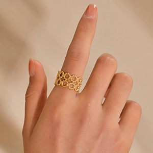 French vintage double-layer geometric hollow gold ring shown on hand in a macro view