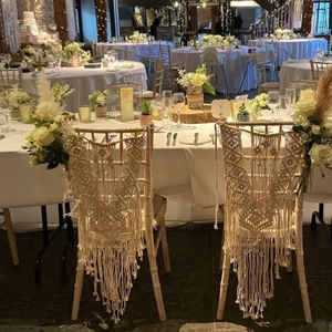 Detailed macro view of Bohemian hand-woven cotton macrame chair decor with long fringes