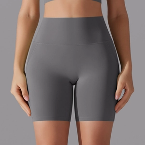 Close-up of high-waisted dark grey yoga shorts featuring a seamless front design