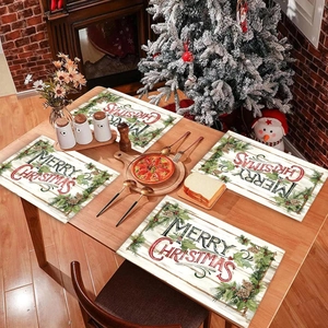 Merry Christmas placemat set with pine branches and berries on a festive holiday table