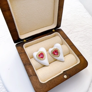 Gold plated heart stud earrings with pink gemstone and pearl trim in a premium box